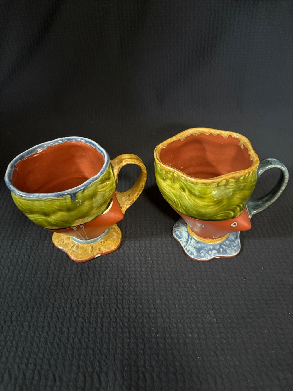 Whimsical abstract  pottery mugs by Raul with incised F and signature
